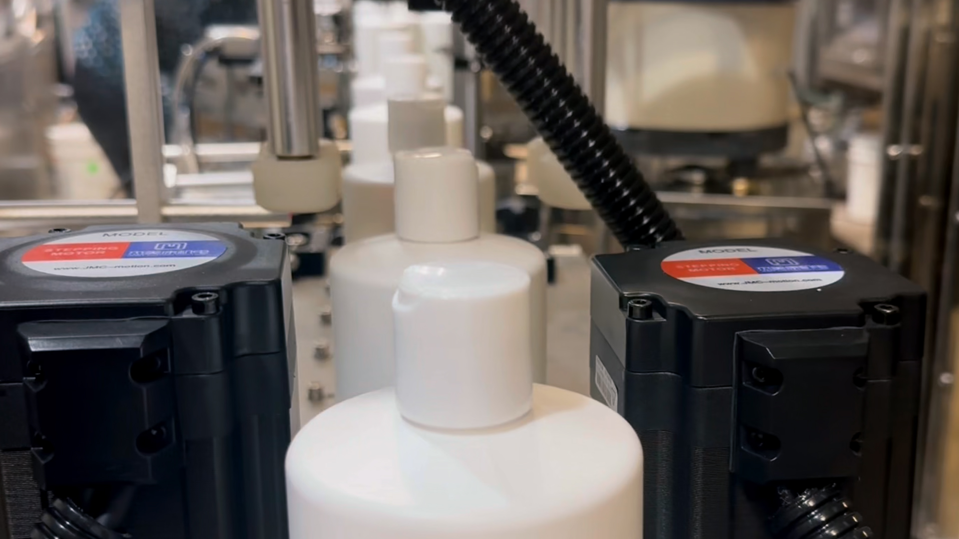 Bottle filling and capping equipment at a cosmetic manufacturing line